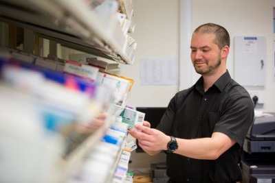A man working in a pharmacy